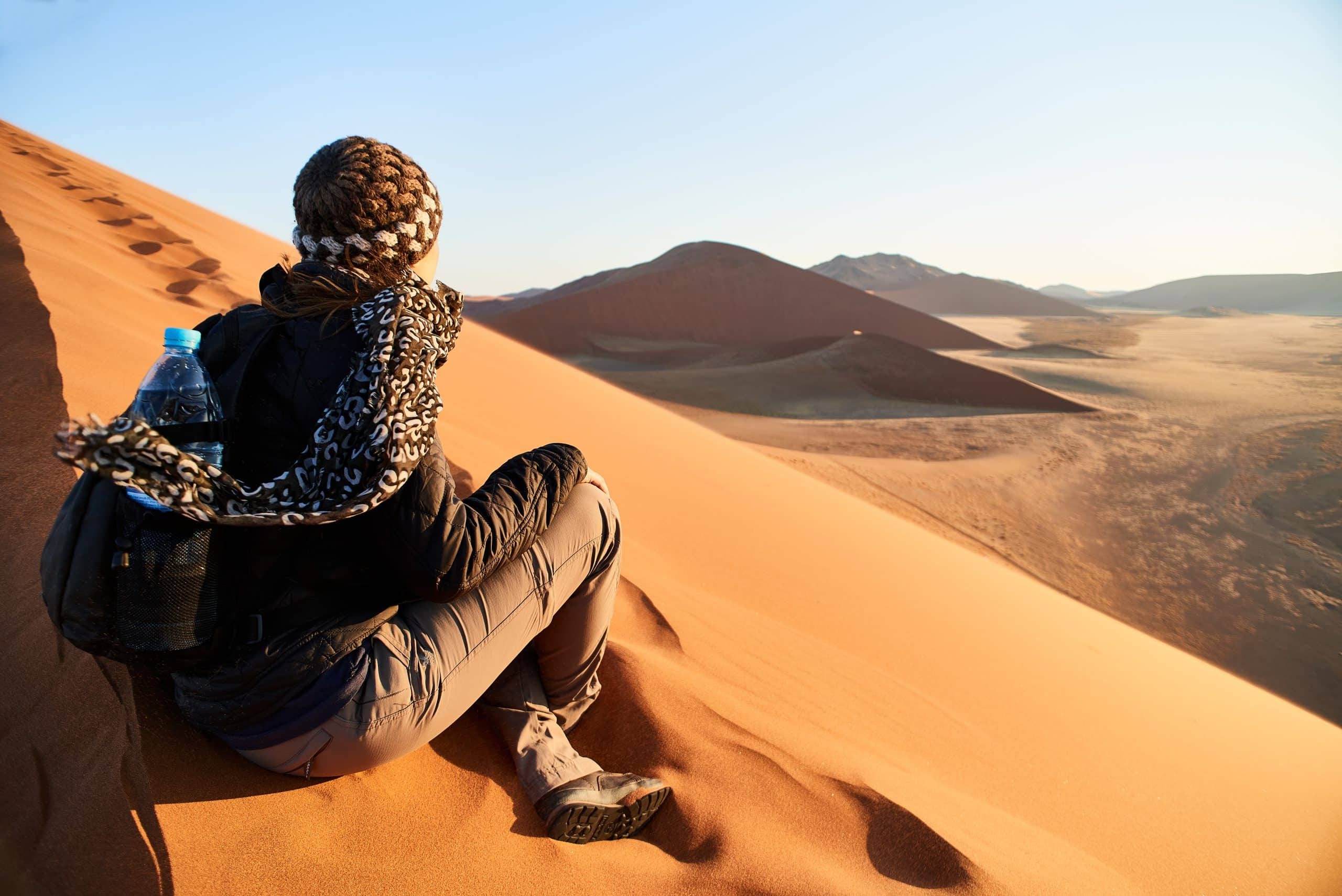 A,Girl,On,A,Dune,Looking,Infitiny