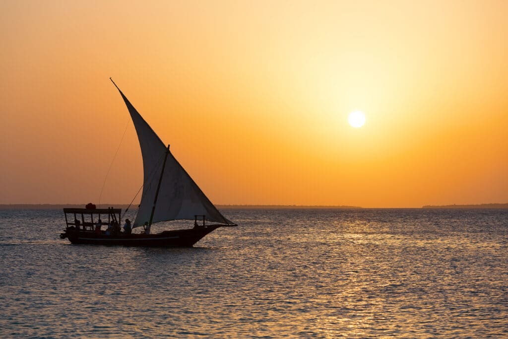 Traditional,Fisherman's,Dhow,Boat,During,Sunset,,Zanzibar,,Tanzania