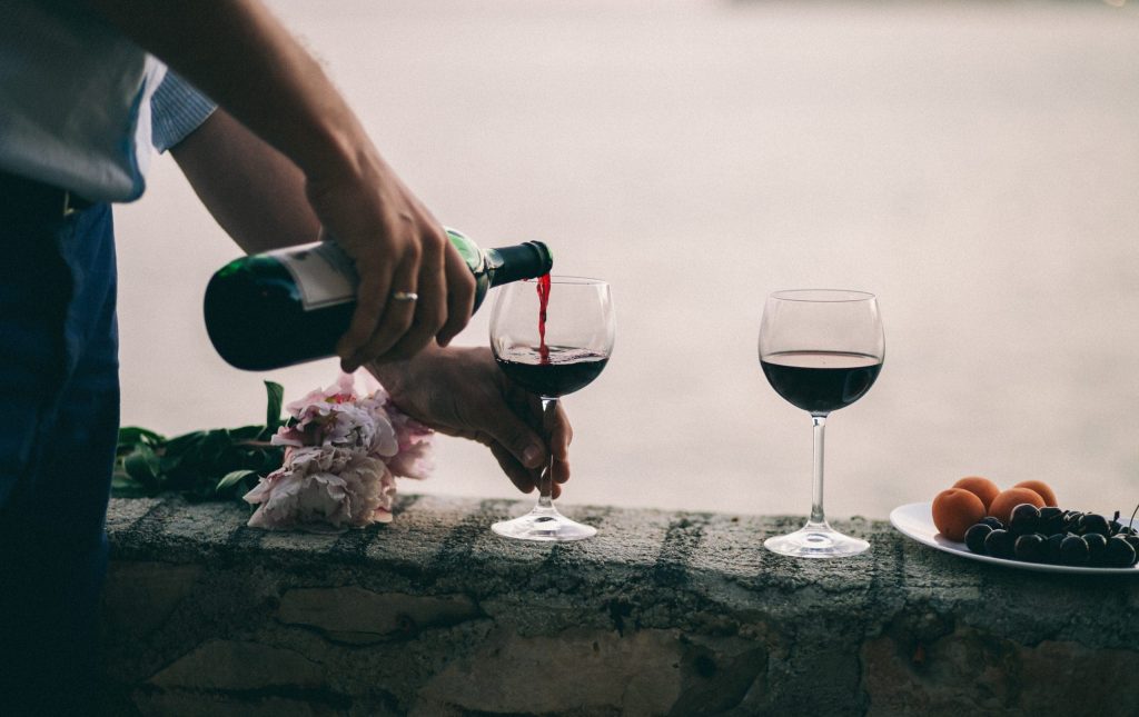 Couple,Drink,Wine,At,Sunset,Beach.,Montenegro