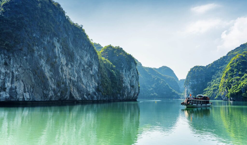 Tourist,Boat,In,The,Halong,Bay,(descending,Dragon,Bay),At