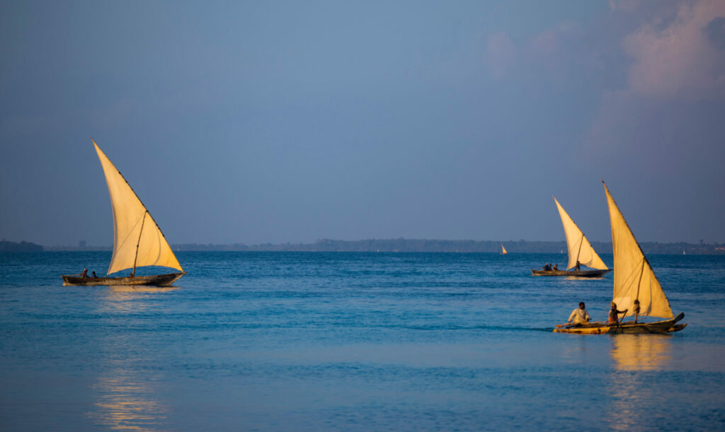 Ancient,Wooden,Sailing,Boats,With,People,On,Board,On,The
