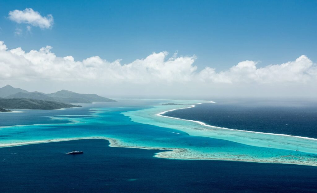 Aerial,View,On,Lagoon,With,Blue,And,Turquoise,Water,,Barrier