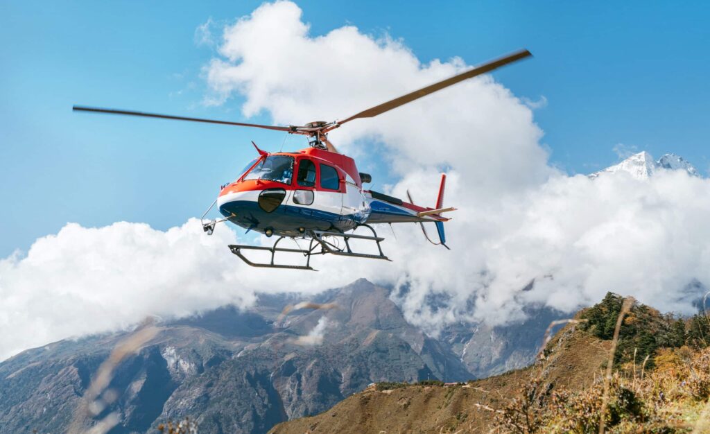 Red,And,White,Medical,Rescue,Helicopter,Landing,In,High,Altitude