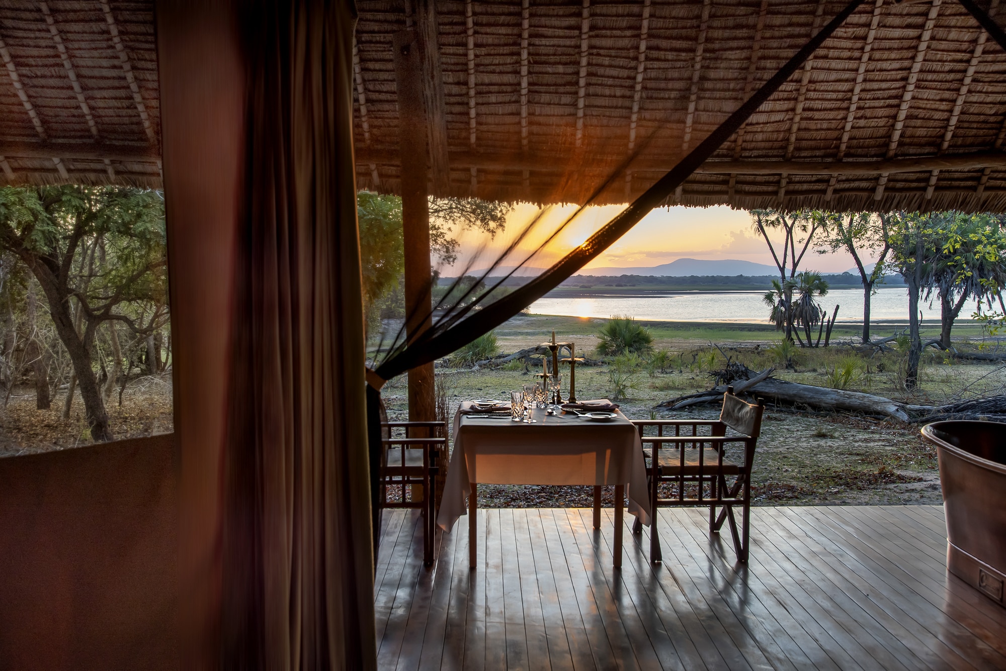 Siwandu Private dinner set up in tented suite with view over Lake Nzerakera