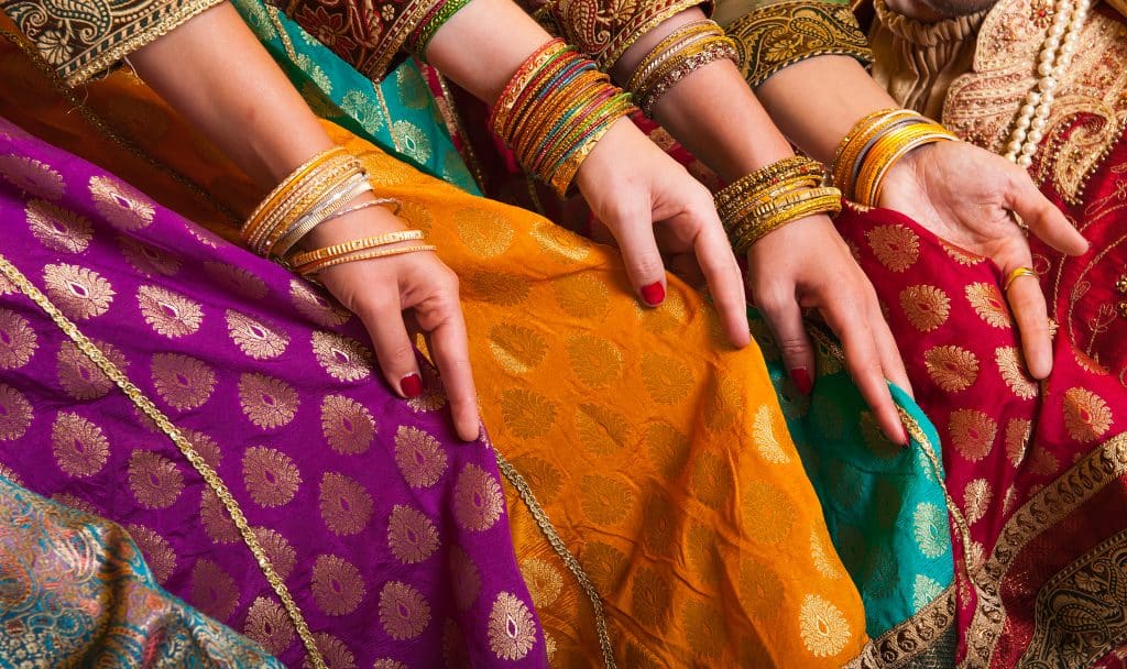 Bollywood,Dancers,Are,Holding,Their,Vivid,Costumes.,Hands,Are,In