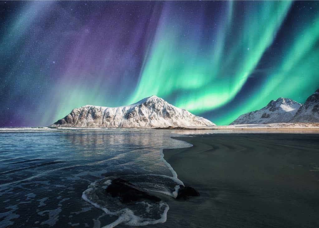 Aurora,Borealis,,Northern,Lights.,Above,On,Snowy,Mountain,In,Skagsanden